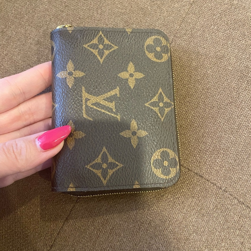 Preowned authentic Louis Vuitton monogram compact wallet